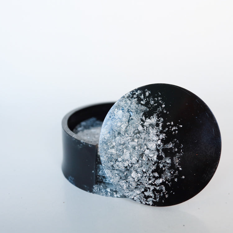 Zwart met vlokken onderzetters met houder